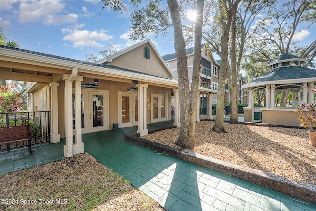 back of house featuring a gazebo