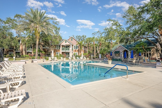 view of swimming pool featuring a patio area