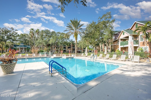 view of swimming pool featuring a patio