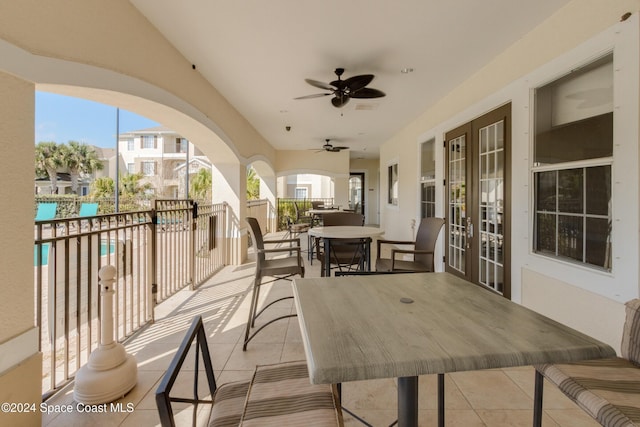 view of patio with a balcony and ceiling fan