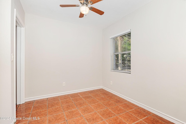 unfurnished room featuring tile patterned floors and ceiling fan