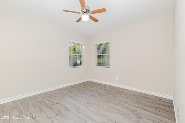 unfurnished room with ceiling fan and light hardwood / wood-style floors