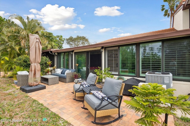 view of patio featuring an outdoor living space and central AC