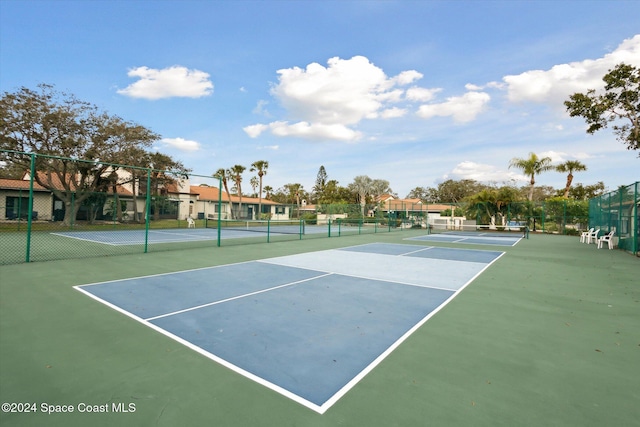 view of sport court with basketball hoop