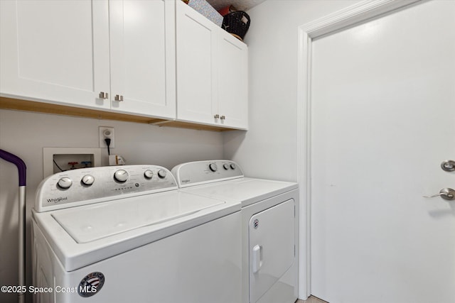 laundry room with cabinets and separate washer and dryer