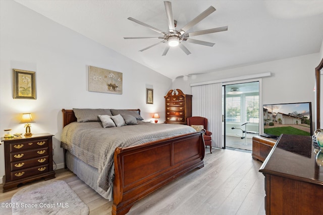 bedroom featuring ceiling fan, light hardwood / wood-style flooring, and vaulted ceiling