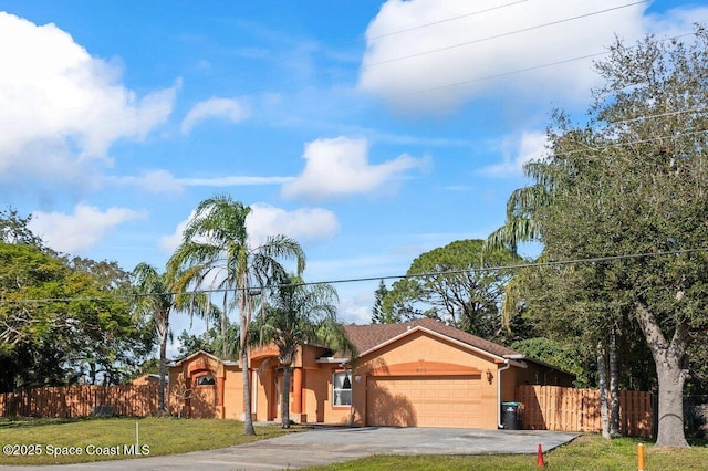 view of front facade featuring a garage and a front lawn