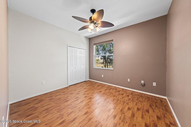 unfurnished room featuring ceiling fan, a textured ceiling, and hardwood / wood-style flooring