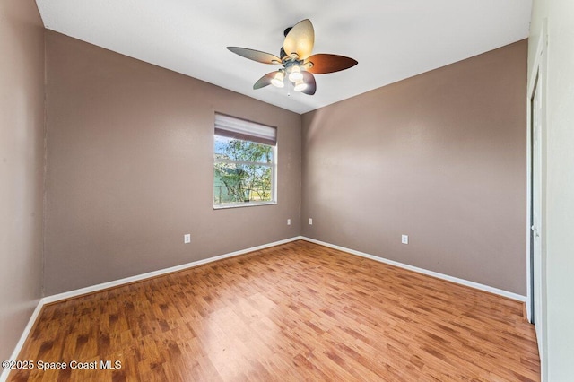 spare room with light hardwood / wood-style flooring and ceiling fan