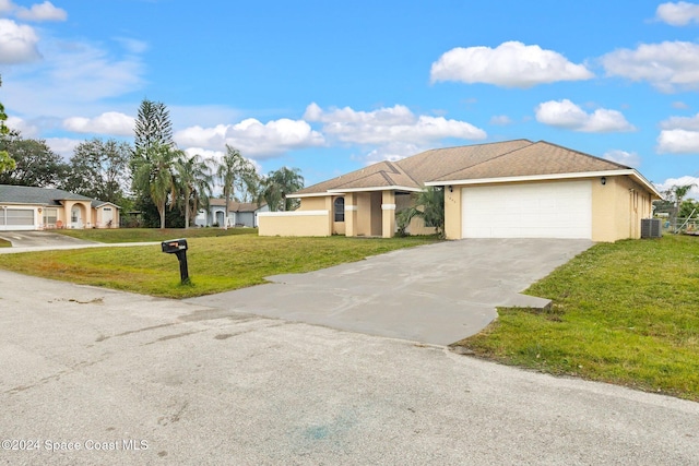 view of front of house featuring cooling unit, a garage, and a front lawn