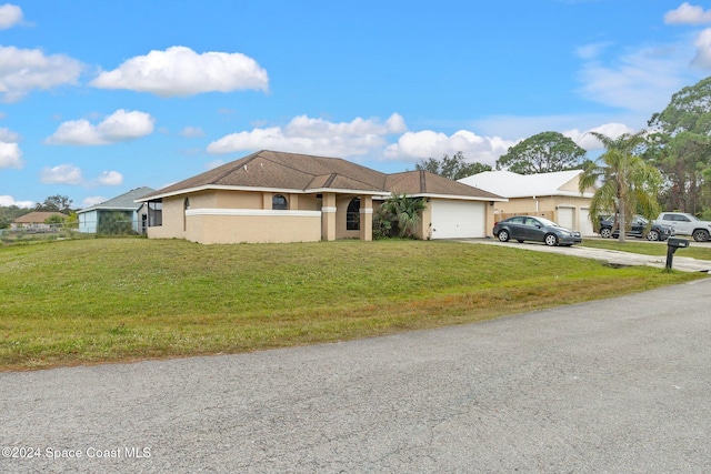 ranch-style house with a garage and a front lawn