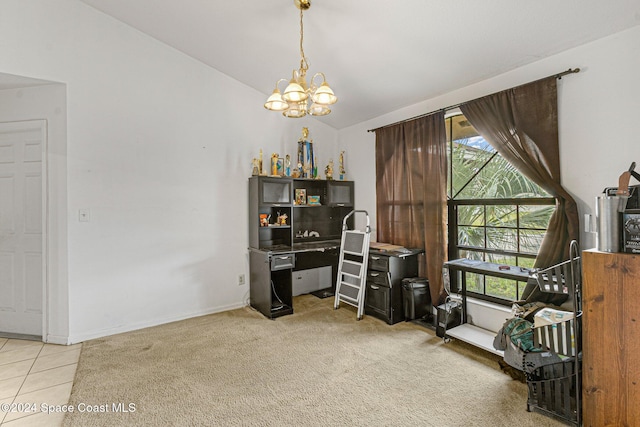 carpeted home office with lofted ceiling and a notable chandelier