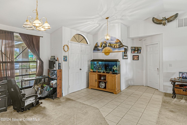 kitchen with light tile patterned floors, pendant lighting, vaulted ceiling, and a notable chandelier