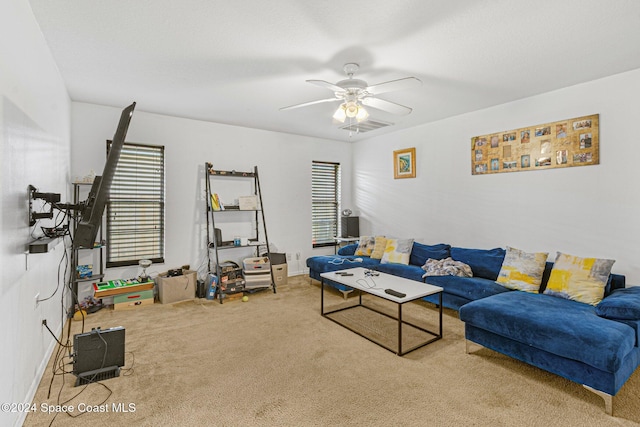 living room featuring carpet and ceiling fan