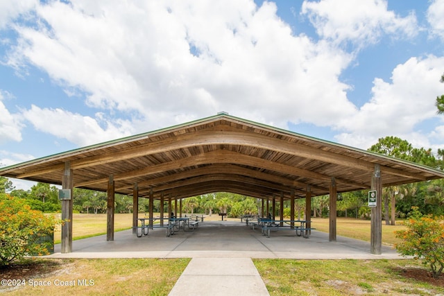 surrounding community with a gazebo and a yard