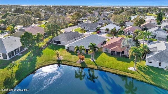 bird's eye view with a water view