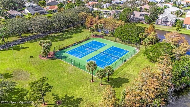 birds eye view of property with a water view