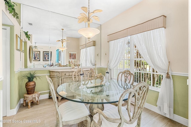 dining room with light hardwood / wood-style floors