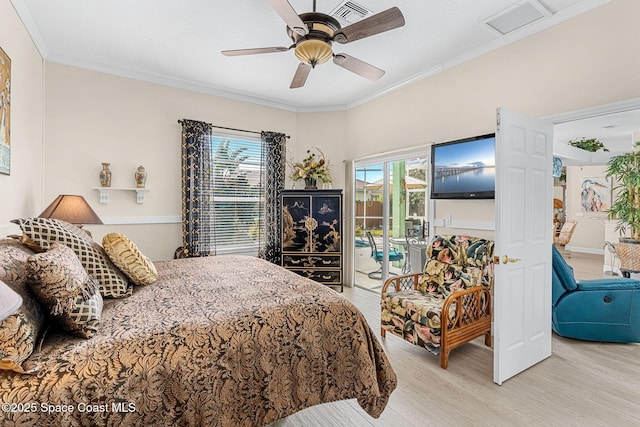 bedroom featuring ceiling fan, access to exterior, light wood-type flooring, and multiple windows