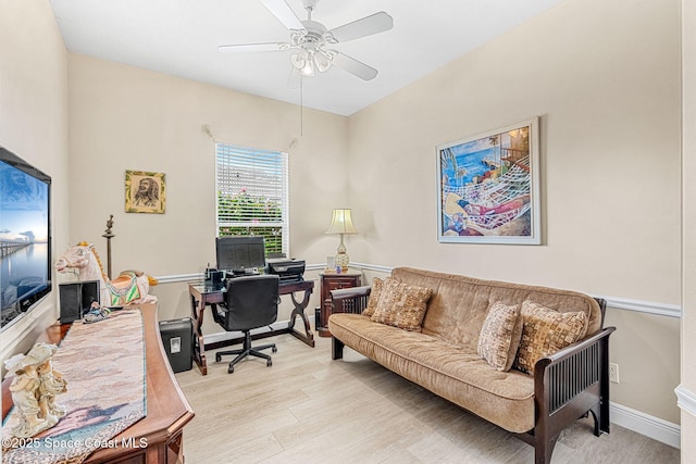 office space with light hardwood / wood-style floors and ceiling fan