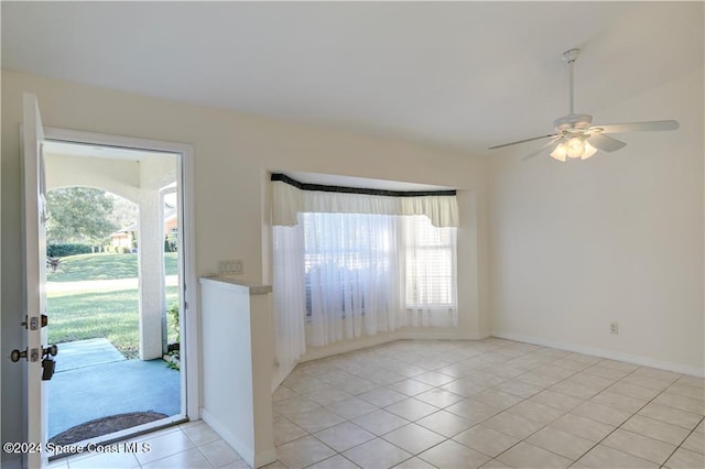 foyer featuring ceiling fan and light tile patterned floors