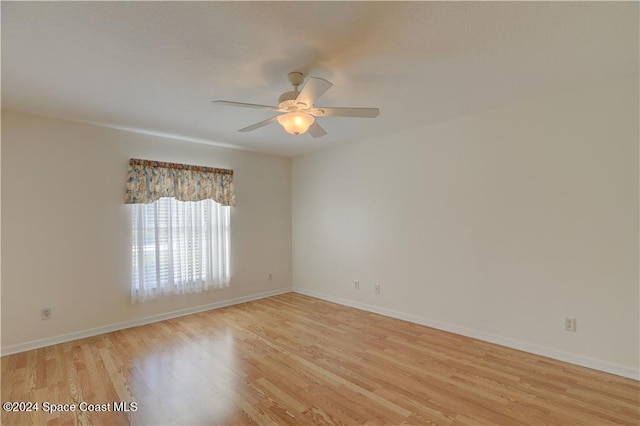 unfurnished room featuring ceiling fan and light hardwood / wood-style floors