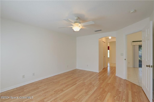 unfurnished room featuring ceiling fan and light wood-type flooring