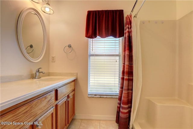 bathroom featuring a shower with curtain, vanity, and tile patterned floors