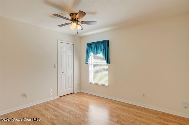 unfurnished room featuring ceiling fan and light hardwood / wood-style floors