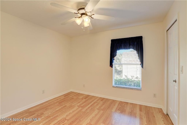 spare room with ceiling fan and light hardwood / wood-style floors