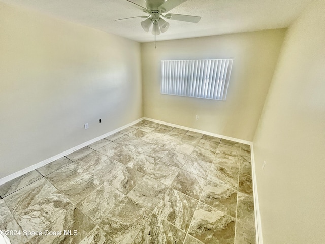 empty room featuring ceiling fan