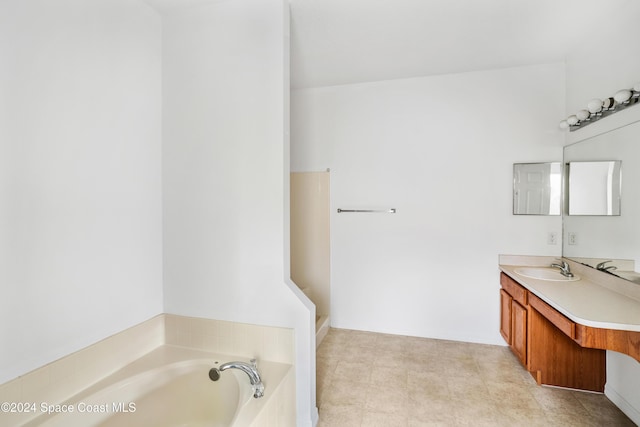 bathroom with vanity and a bathtub