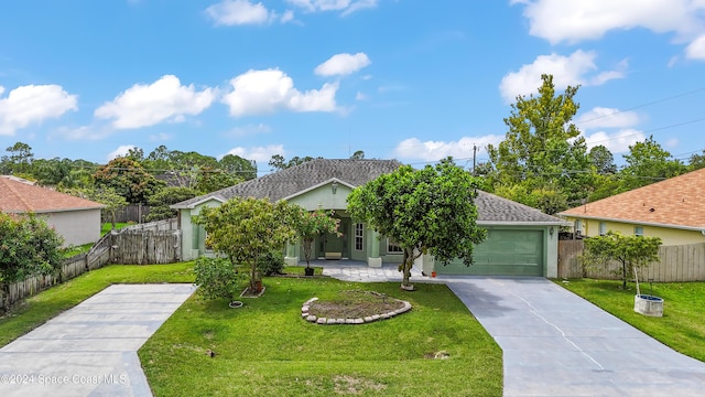 view of front facade featuring a garage and a front lawn