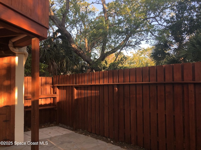 view of patio / terrace featuring fence