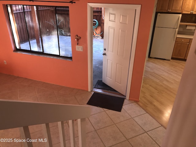 foyer featuring light tile patterned flooring