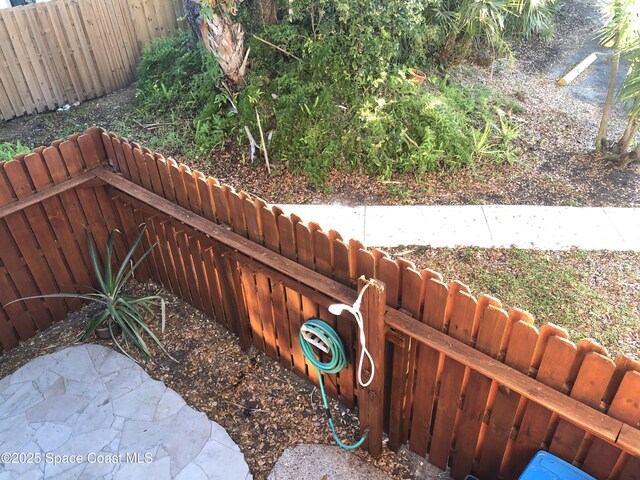 details with a fenced backyard