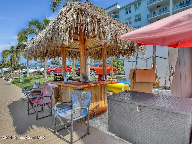 wooden terrace featuring a bar