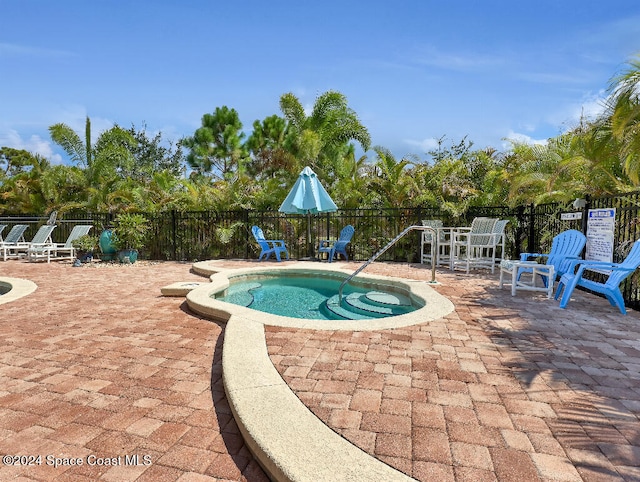 view of pool featuring a patio area