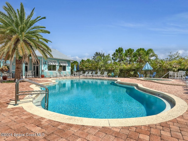 view of pool featuring a patio area