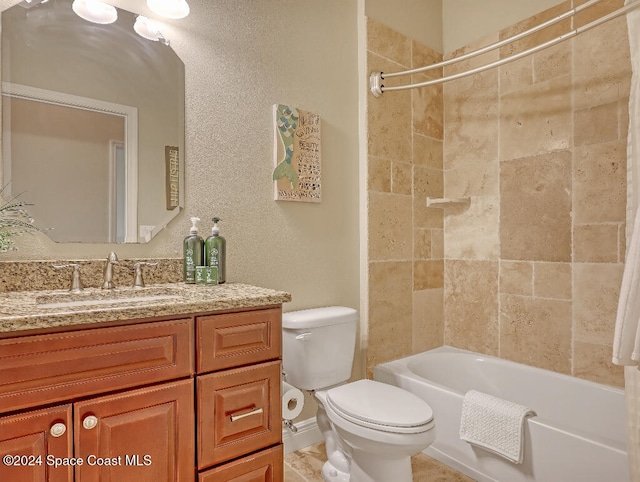 full bathroom with vanity, toilet, and tiled shower / bath combo