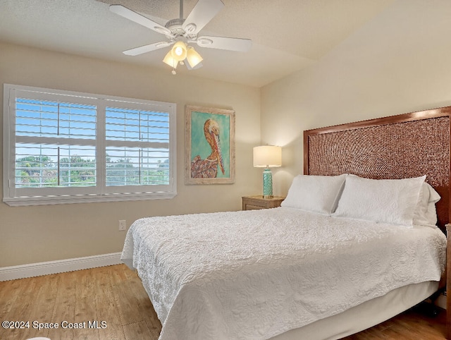 bedroom featuring hardwood / wood-style flooring and ceiling fan