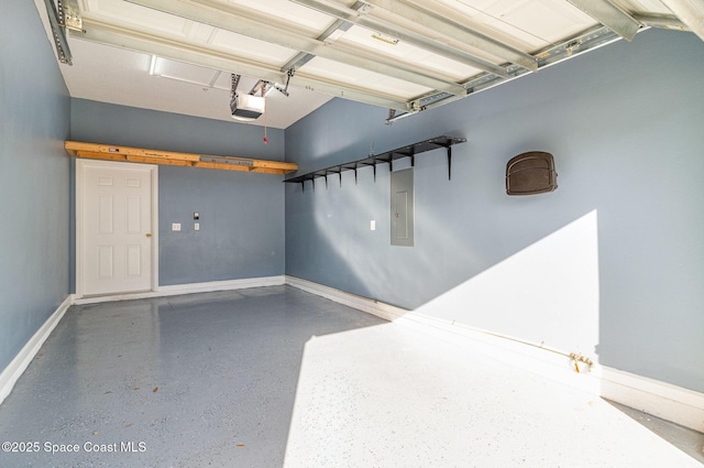 garage featuring electric panel, baseboards, and a garage door opener