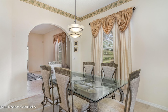 dining room featuring light tile patterned flooring