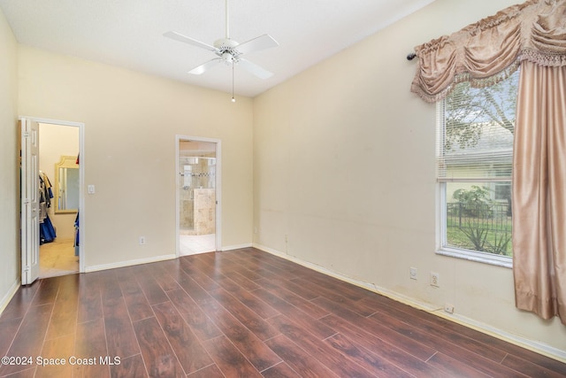 unfurnished room featuring dark hardwood / wood-style floors, ceiling fan, and a healthy amount of sunlight