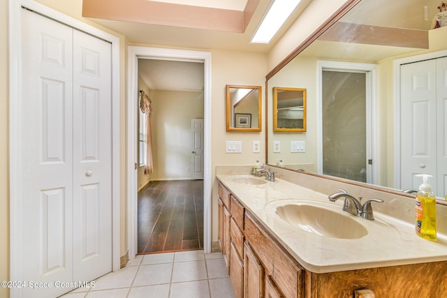 bathroom with tile patterned floors and vanity