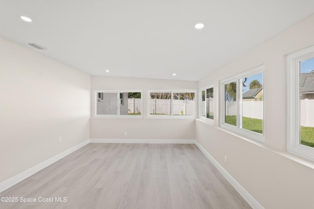 spare room featuring light hardwood / wood-style floors