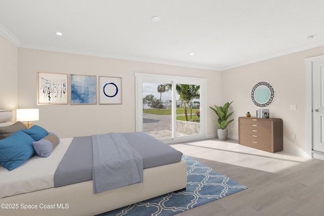 bedroom featuring access to exterior, light hardwood / wood-style floors, and crown molding