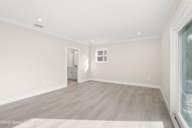 unfurnished room featuring light wood-type flooring and crown molding