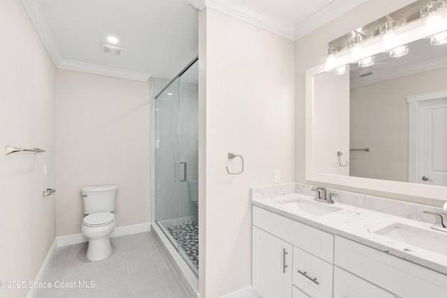 bathroom with tile patterned flooring, crown molding, toilet, and walk in shower