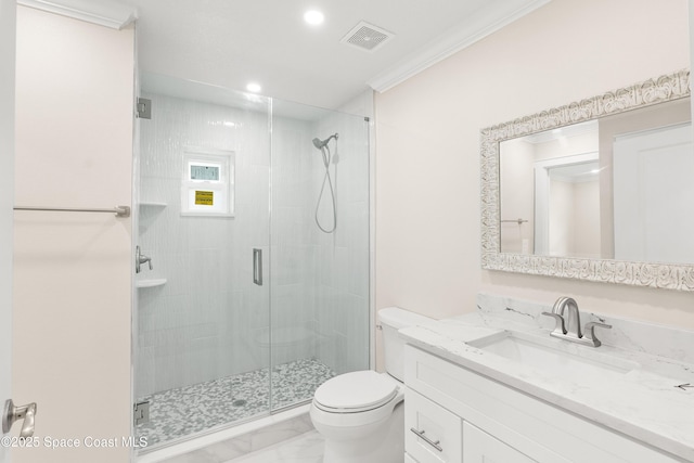 bathroom featuring an enclosed shower, vanity, toilet, and ornamental molding